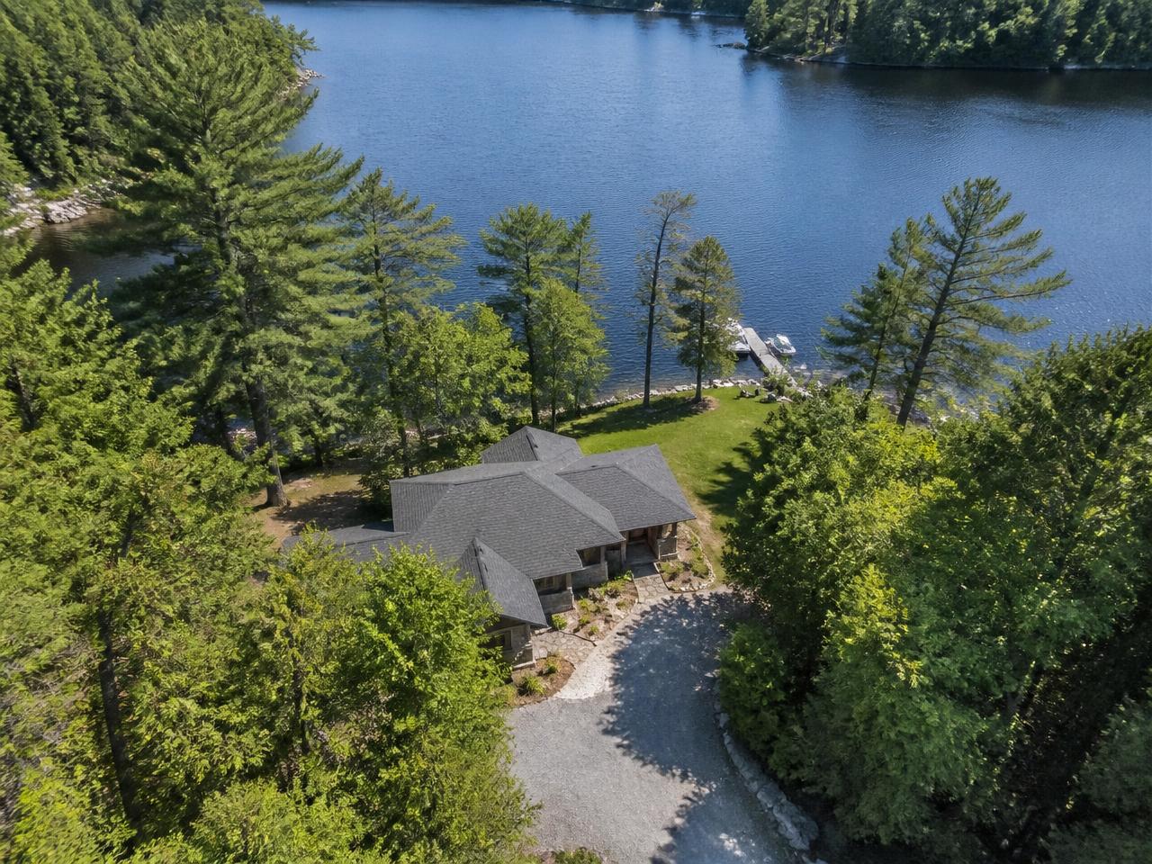 Preview of a Muskoka Watch sample cottage watch inspection report showing a waterfront property overview